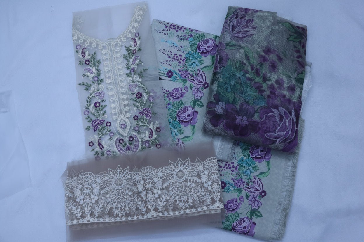 Embroidered fabric pieces with floral patterns on a white background