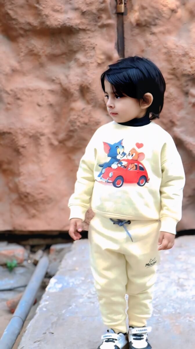 Boy wearing the MODST Tom and Jerry sweatshirt and joggers set